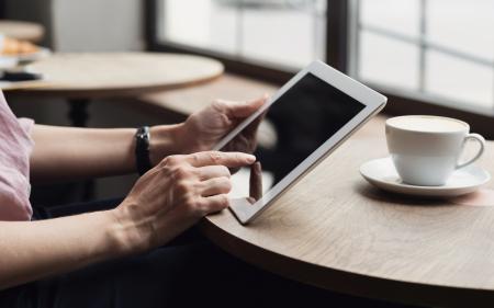 Tablet Reading in a Coffee Shop